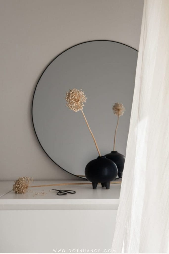 how to arrange flowers - single stem in black vase